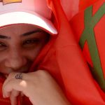 A Moroccan woman wrapped in her national flag takes part in a rally organized by the Moroccan Unions and marking the International Labour Day on May 1, 2014 in Casablanca. AFP PHOTO / FADEL SENNA        (Photo credit should read FADEL SENNA/AFP/Getty Images)