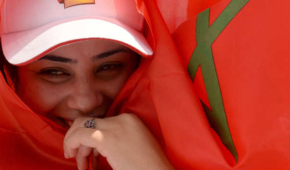 A Moroccan woman wrapped in her national flag takes part in a rally organized by the Moroccan Unions and marking the International Labour Day on May 1, 2014 in Casablanca. AFP PHOTO / FADEL SENNA        (Photo credit should read FADEL SENNA/AFP/Getty Images)